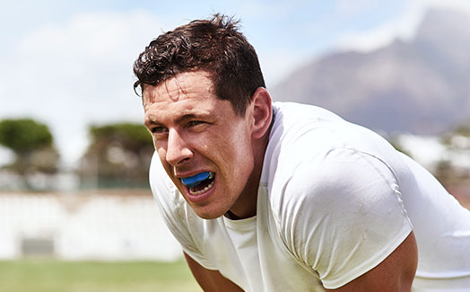 Man playing sports with mouthguard